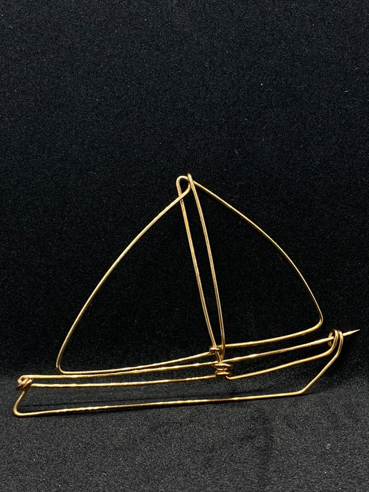 Boat brooch in bronze
